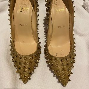 Christian Louboutin gold studded pumps